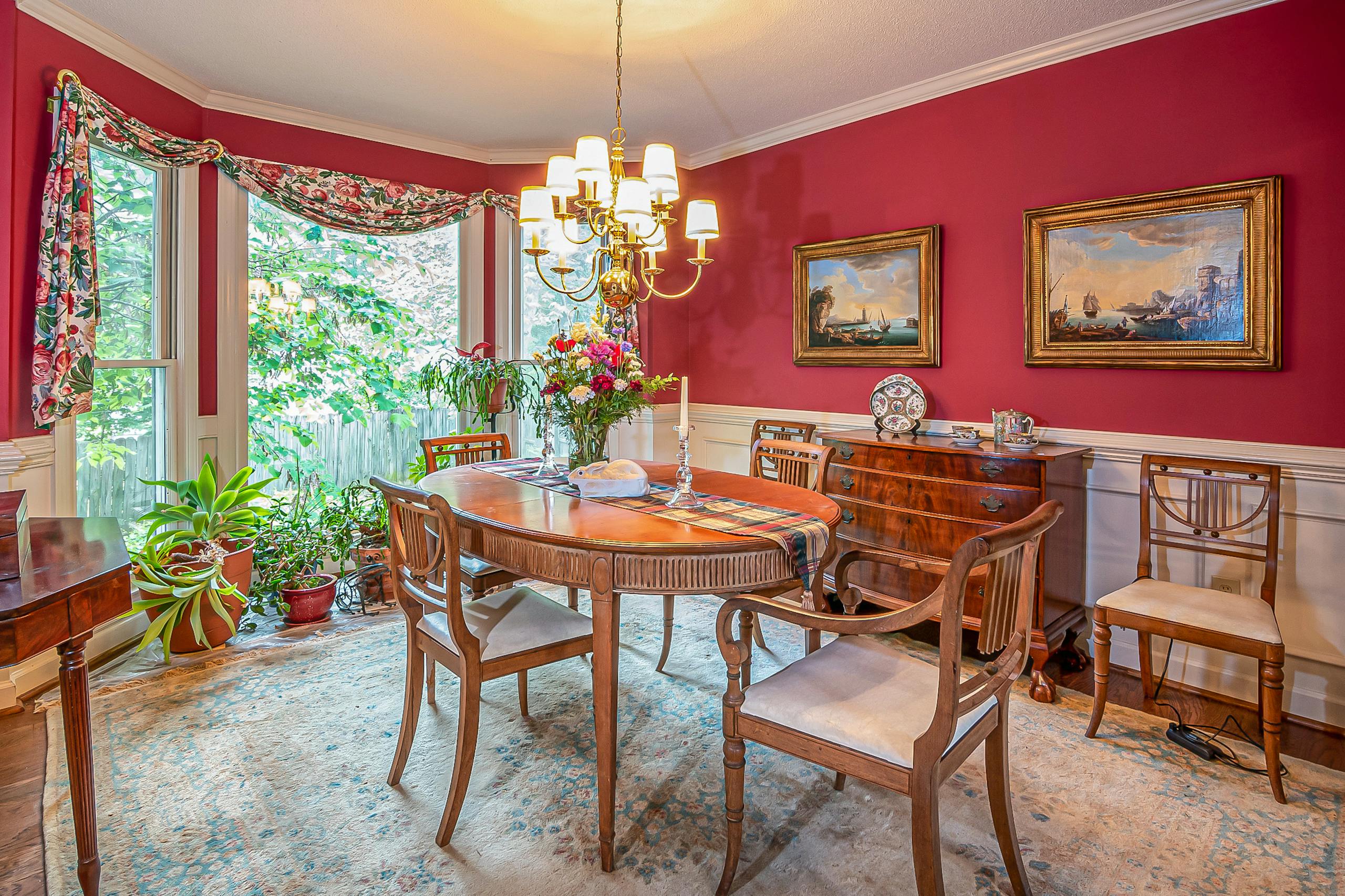 Brass Curtain Rods A cozy and elegant dining room featuring vintage furniture and warm lighting.