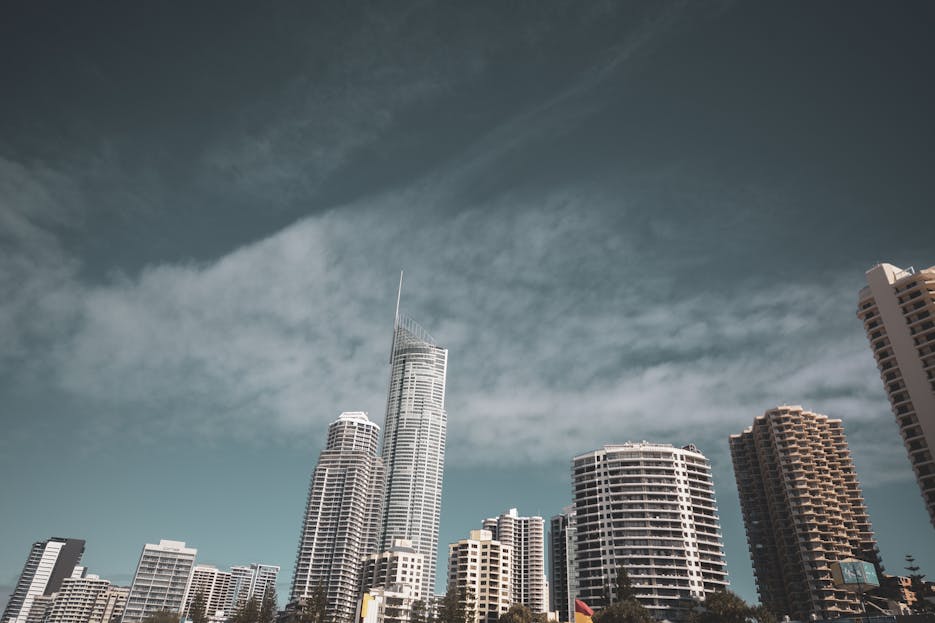 QLCredit  A stunning view of Surfers Paradise skyline with modern skyscrapers under a clear blue sky.