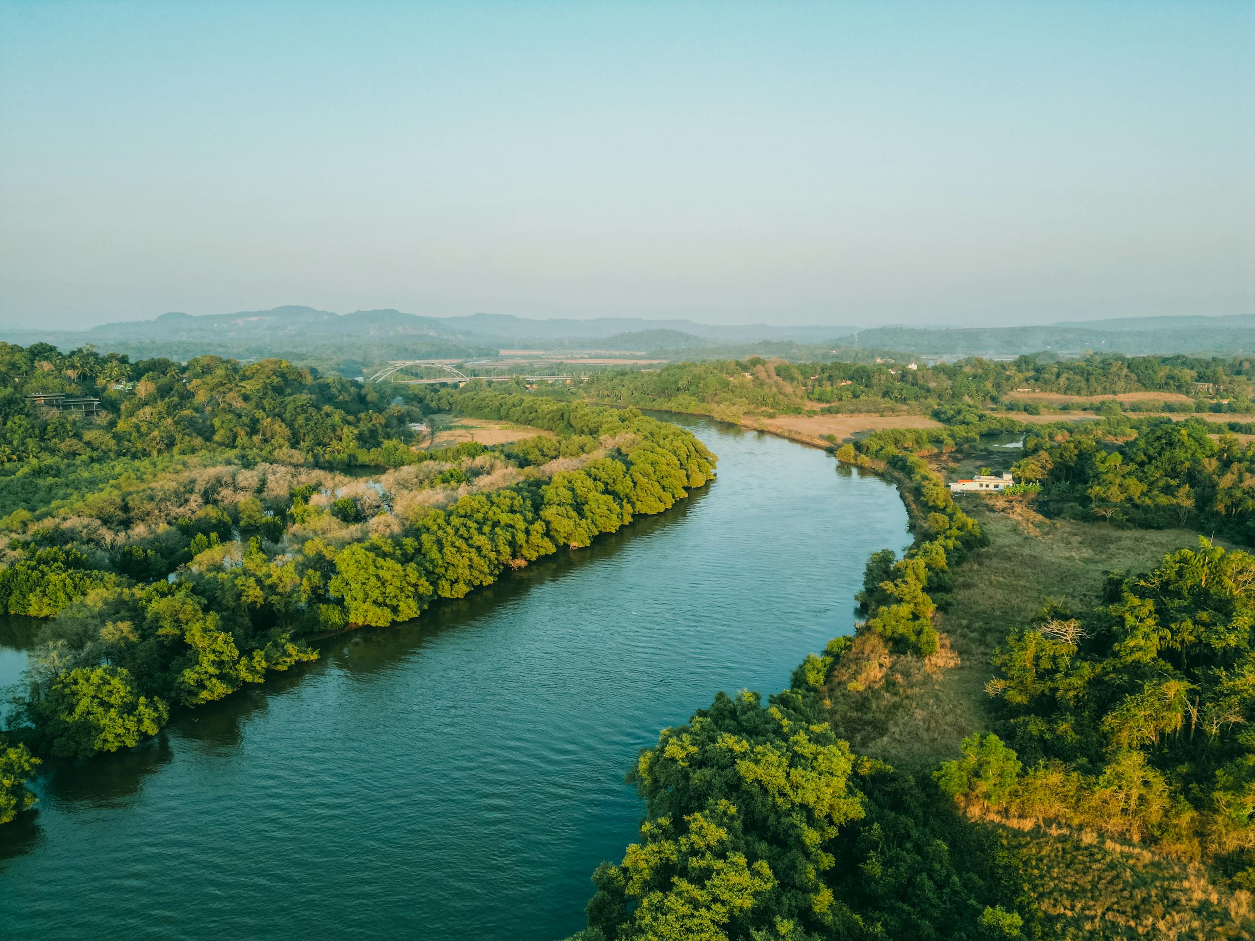 GotAnyNudes Breathtaking aerial view of a lush, meandering river landscape in Goa, India.