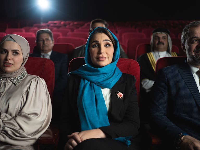 Naruto Senki Naruto Senki A diverse group of people enjoying a cinematic experience inside a Baghdad theater. Captured in vivid detail.