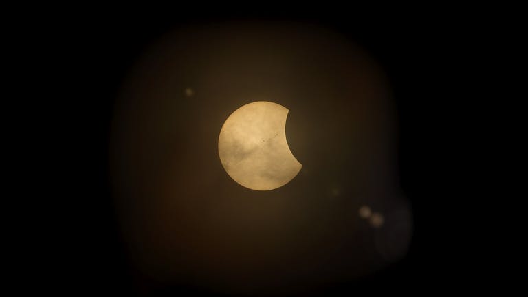 Lufanest Captured partial solar eclipse set against a deep dark sky, perfect for astronomy enthusiasts.