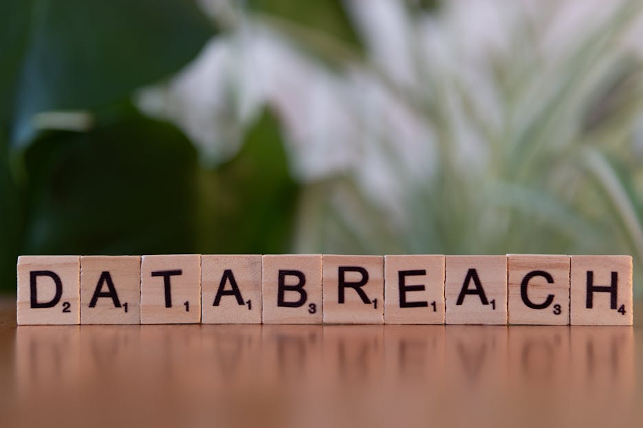 Privacy Policy Gonzay.com   Close-up of Scrabble tiles spelling 'data breach' on a blurred background