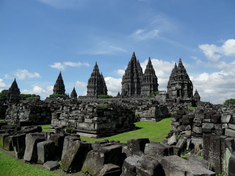 Hindu Temple Near Me Explore the ancient Prambanan Temple in Java, Indonesia, with stunning stone architecture against a clear blue sky.