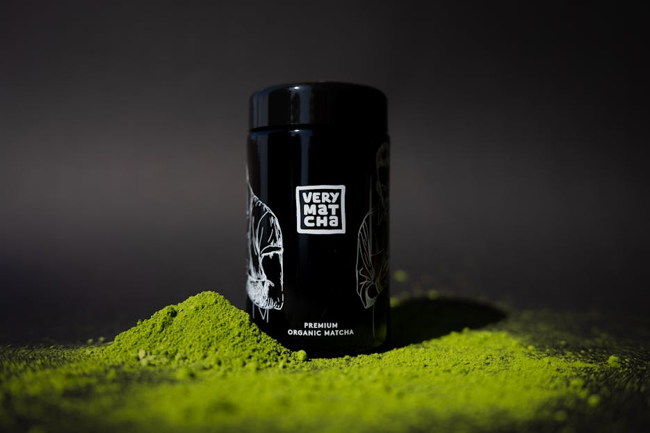 Bin Matcha Photo of premium organic matcha with black packaging against a dark background.