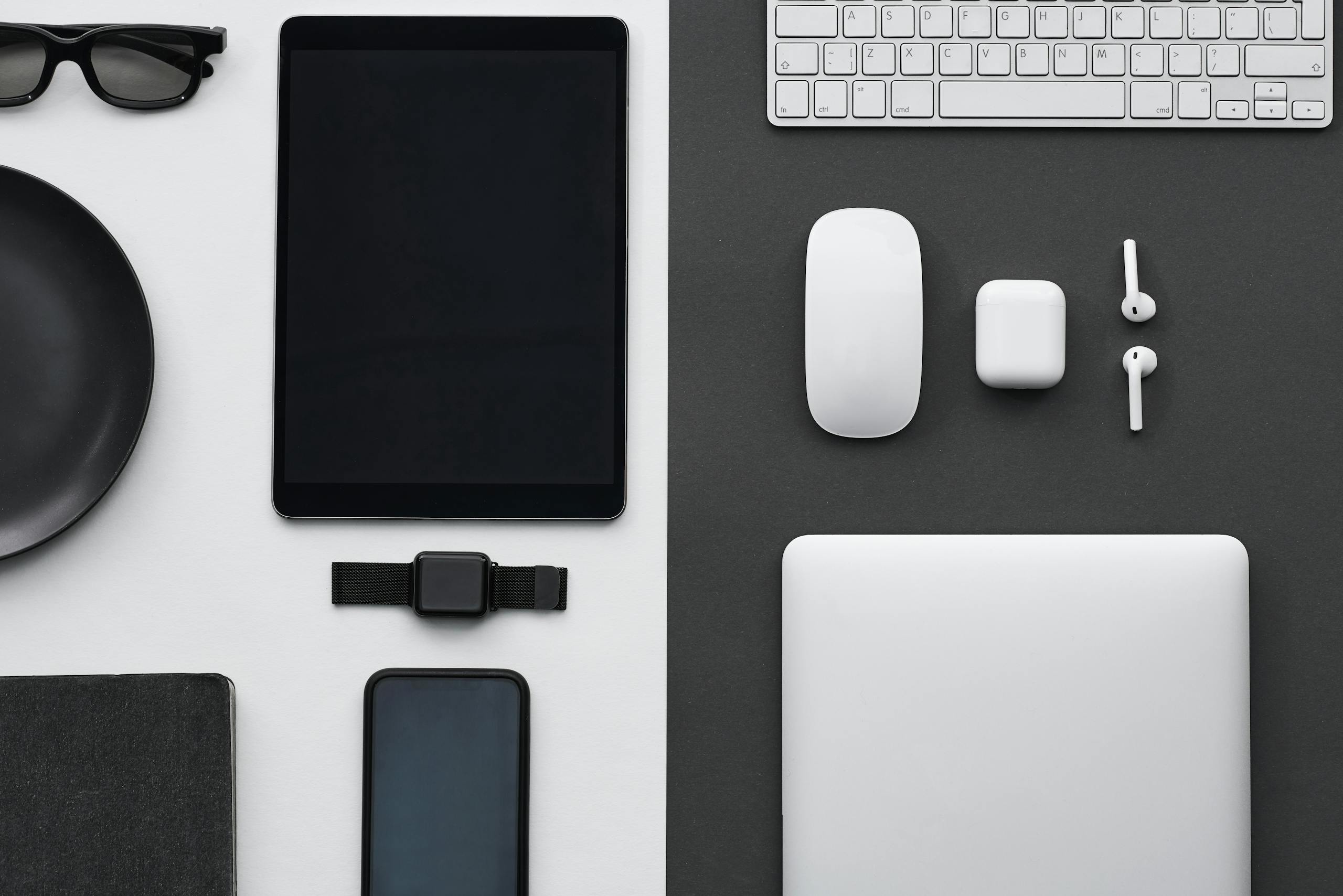 ksözcü impupdates Stylish flatlay of modern tech gadgets including tablet, smartphone, smartwatch, and accessories.