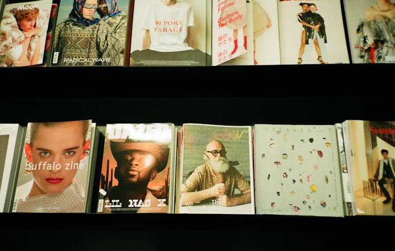 Vents Magazine Colorful assortment of fashion magazines displayed on a retail shelf in a bookstore.