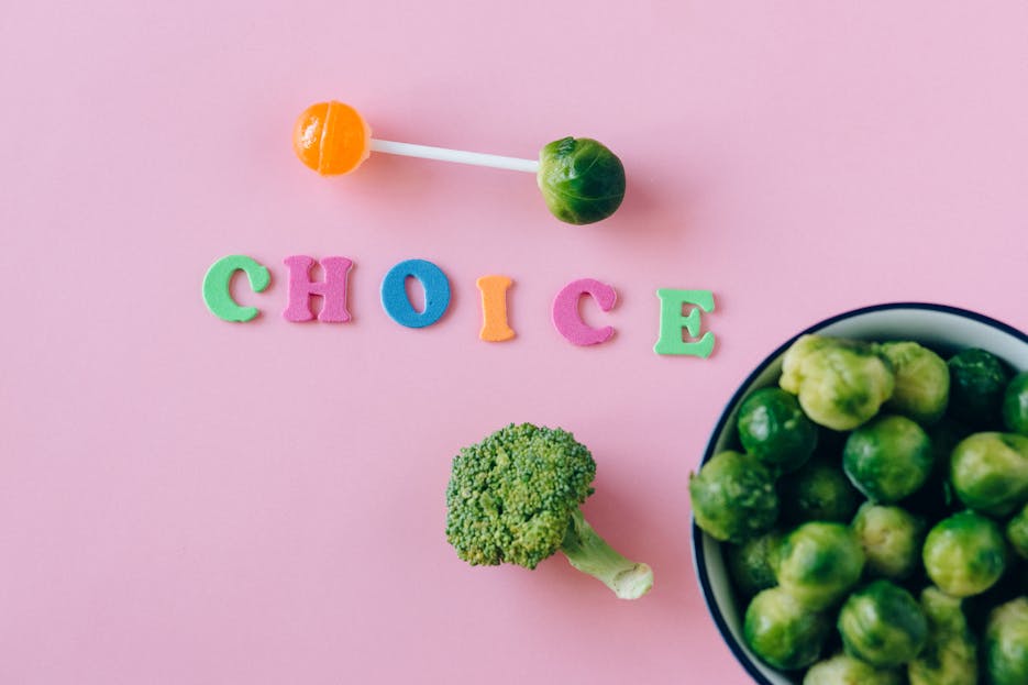 Nueraji vs Crosbie Prediction Colorful depiction of healthy and sweet food choices on pink backdrop.