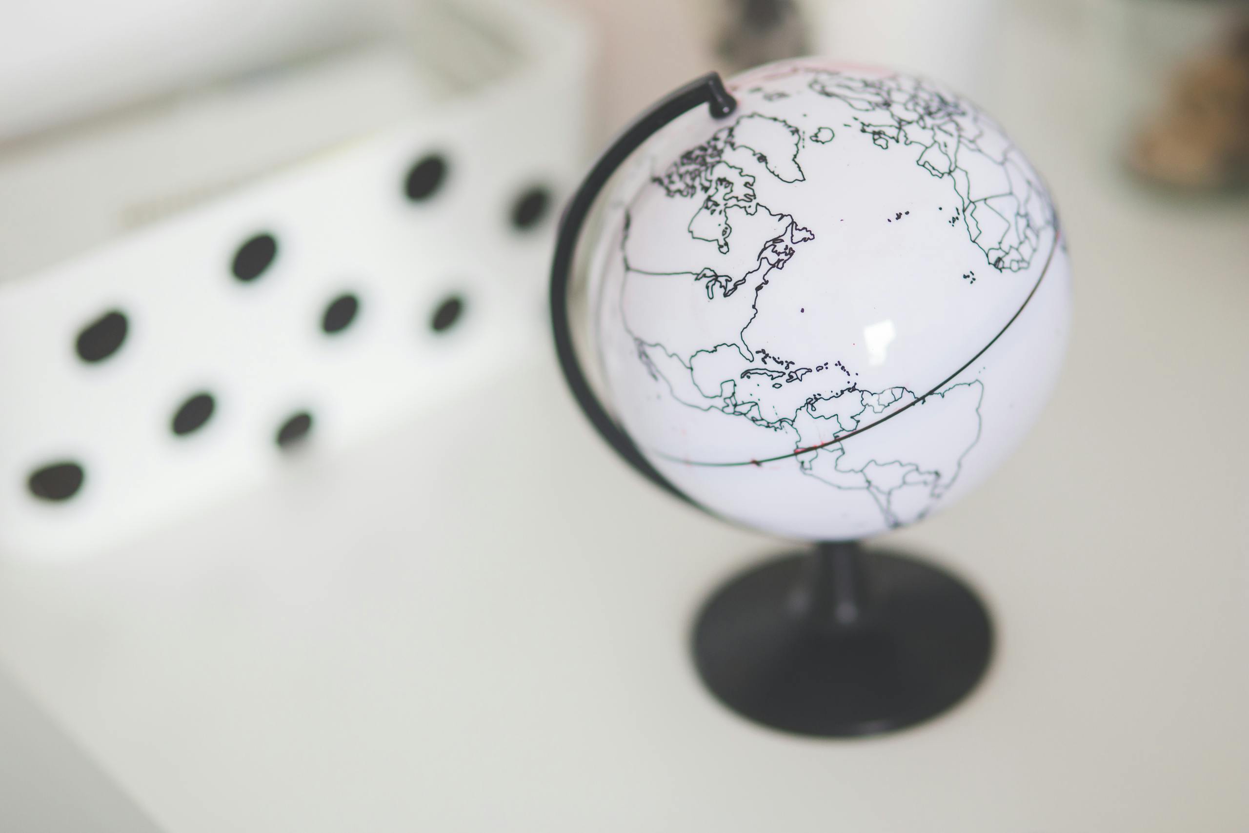 TheGlobeAndMailElegant close-up of a minimalist white globe in a modern indoor setting.