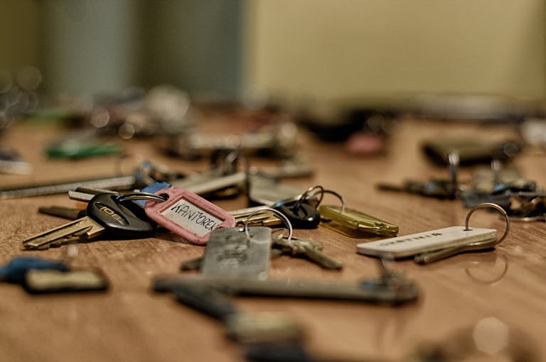 Fetid Key OSRS Macro shot of various metallic keys scattered on a wooden surface.