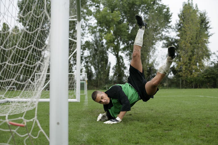 Wynonna Judd Performance Reactions Soccer goalkeeper makes a dramatic save midair during a game.