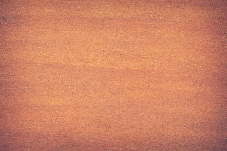 Redeepseek Vibrant orange textured surface, perfect for design backdrops and creative projects.
