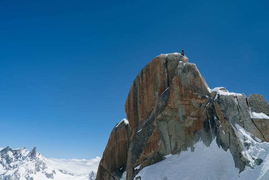 Jant Blanc A lone climber stands atop a snowy peak in Chamonix-Mont-Blanc, France.