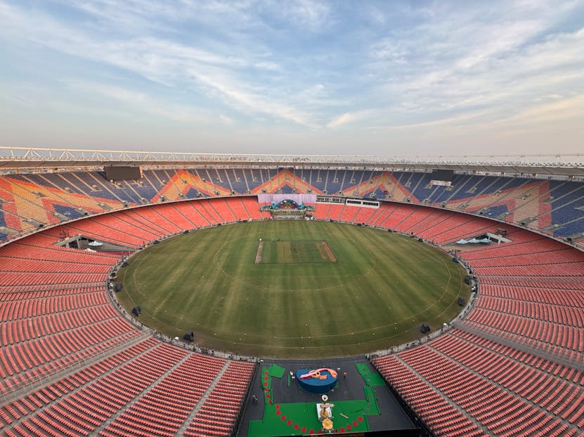 Iplleague2026 Wide-angle aerial view of the iconic Narendra Modi Stadium in Ahmedabad, India, at day.