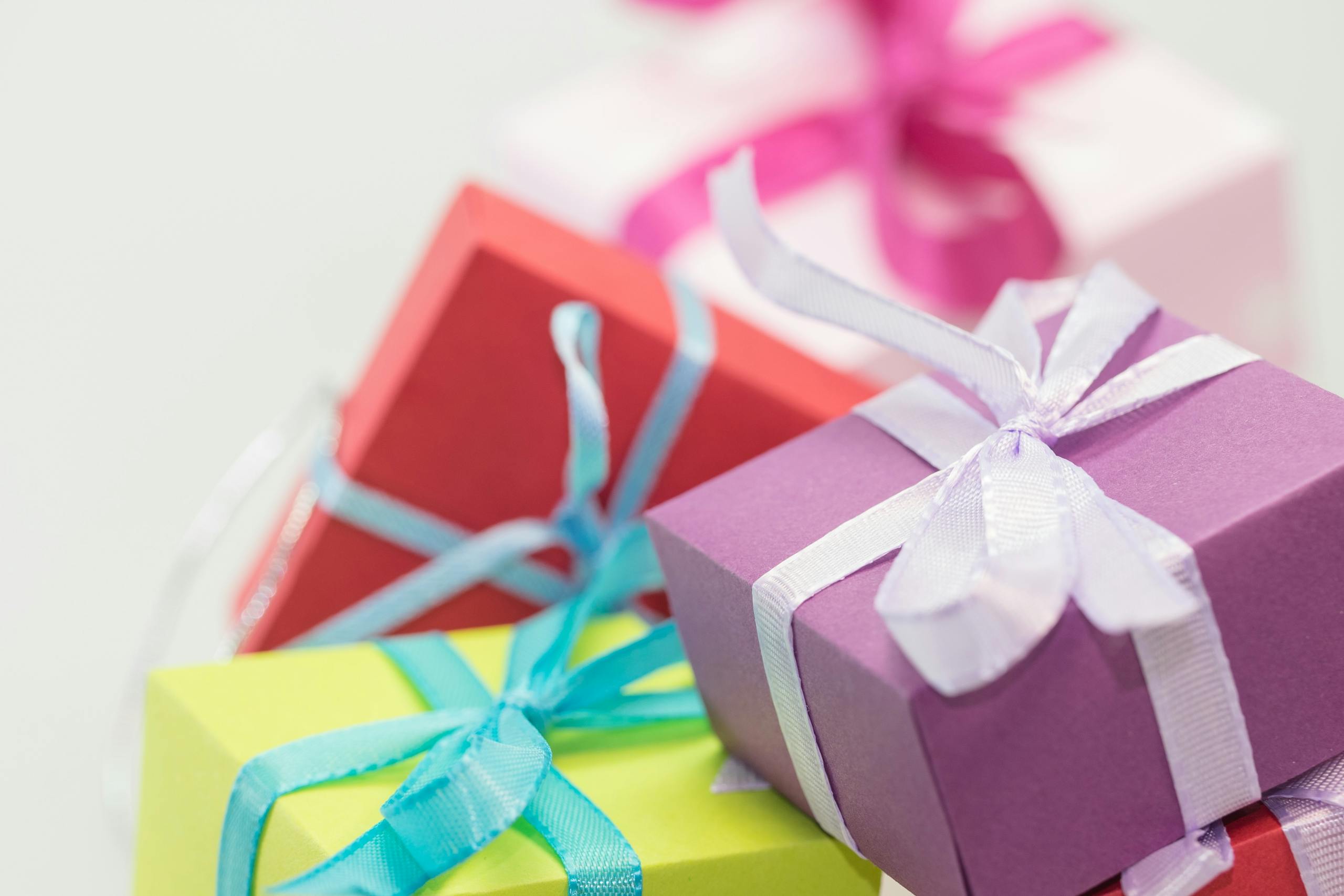 WhatUTalkingBoutWillis Gifts Close-up of vibrant gift boxes with ribbons, perfect for festive occasions.