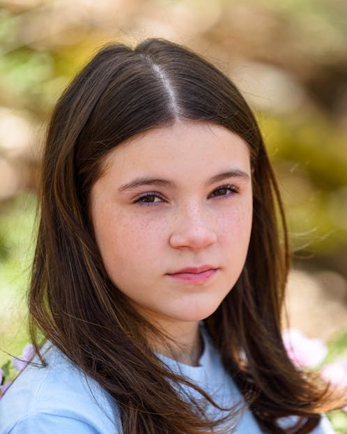 Finley Elaine Griffin Close-up portrait of a teen girl outdoors in natural daylight.