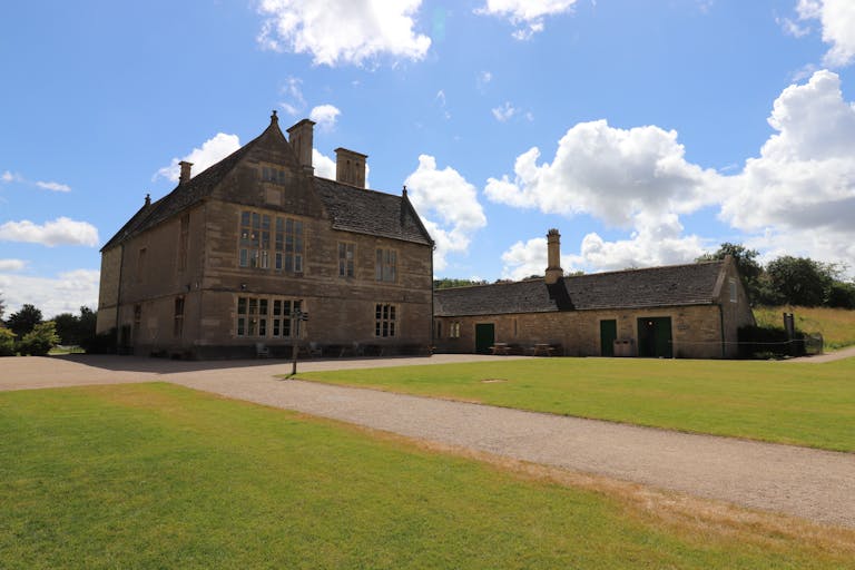 Pabington Stunning architecture at Lyveden, capturing historic English charm under a bright blue sky.