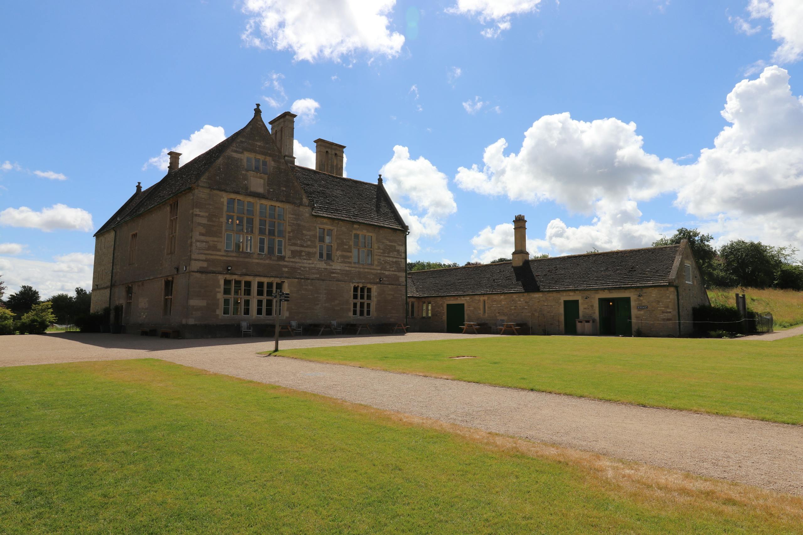Pabington Stunning architecture at Lyveden, capturing historic English charm under a bright blue sky.